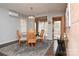 Bright dining room with elegant chandelier, decorative rug, and access to outdoor area at 198 Clouse Ln, Taylorsville, NC 28681