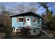 Quaint blue cottage with white trim and a small deck at 198 Clouse Ln, Taylorsville, NC 28681