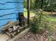 Charming front porch featuring a blue exterior with welcoming rustic decor and a wooded backdrop at 198 Clouse Ln, Taylorsville, NC 28681