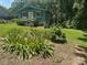 Quaint cottage-style home with well-manicured lawn and vibrant flowerbeds in a peaceful, wooded setting at 198 Clouse Ln, Taylorsville, NC 28681