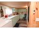 Efficient kitchen featuring white appliances and light teal cabinetry at 198 Clouse Ln, Taylorsville, NC 28681