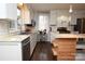 Bright kitchen with marble counters, stainless steel appliances, and tile backsplash at 198 Clouse Ln, Taylorsville, NC 28681
