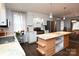 Modern kitchen with island, stainless steel appliances, and natural light at 198 Clouse Ln, Taylorsville, NC 28681