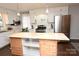 Stylish kitchen featuring white cabinetry, island, and stainless steel appliances at 198 Clouse Ln, Taylorsville, NC 28681
