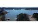 Aerial view showcases the lake, including docks and a boat launch area at 198 Clouse Ln, Taylorsville, NC 28681
