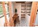 Small office space featuring a built-in desk, unique tile floors, and custom shelving for storage at 198 Clouse Ln, Taylorsville, NC 28681