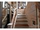 Unique staircase with driftwood railing and library view at 198 Clouse Ln, Taylorsville, NC 28681