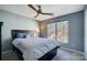 Cozy bedroom with a queen bed and large window overlooking backyard at 19906 Catamaran Ct, Cornelius, NC 28031