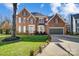 Brick two-story house with attached garage and manicured lawn at 19906 Catamaran Ct, Cornelius, NC 28031