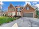 Brick house with two-car garage and manicured lawn at 19906 Catamaran Ct, Cornelius, NC 28031