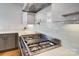 Stainless steel range and griddle highlight this contemporary kitchen at 19906 Catamaran Ct, Cornelius, NC 28031