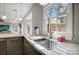 Kitchen sink with a stainless steel faucet and white quartz countertop at 19906 Catamaran Ct, Cornelius, NC 28031