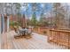 Wooden deck with patio furniture and umbrella, overlooking woods at 2044 Chameleon Rd, York, SC 29745