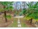 Relaxing fire pit area with stone seating and lush landscaping at 2044 Chameleon Rd, York, SC 29745