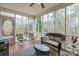 Relaxing screened porch with wicker furniture and wood flooring at 2044 Chameleon Rd, York, SC 29745