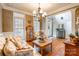 Sitting room with hardwood floors, chandelier, and floral furniture at 2044 Chameleon Rd, York, SC 29745