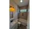 Bathroom with a bathtub, vanity, and neutral tile at 2045 Cordia Cir, Newton, NC 28658