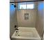 Bathroom with a bathtub, shower, and modern tile at 2045 Cordia Cir, Newton, NC 28658