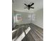 Light-filled bedroom featuring wood-look floors and a ceiling fan at 2045 Cordia Cir, Newton, NC 28658