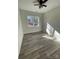 Bright bedroom with wood-look floors, large window, and ceiling fan at 2045 Cordia Cir, Newton, NC 28658