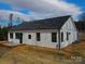 Rear of house with white siding, black windows and a black door at 2045 Cordia Cir, Newton, NC 28658