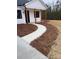 Landscaped front yard with a curved walkway leading to the front porch at 2045 Cordia Cir, Newton, NC 28658