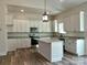 Modern kitchen with island, stainless steel appliances, and white cabinets at 2045 Cordia Cir, Newton, NC 28658