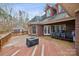 Large deck with seating area, fire pit, and views of the backyard at 2113 Sweet Clover Way, Denver, NC 28037