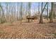 Wooded backyard with elevated deck and treetop views at 2113 Sweet Clover Way, Denver, NC 28037