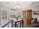 Bright breakfast nook with large windows and a wood china cabinet at 2113 Sweet Clover Way, Denver, NC 28037