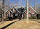 Well-maintained brick home with symmetrical design, professional landscaping, and inviting entrance at 2113 Sweet Clover Way, Denver, NC 28037