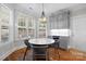 Charming breakfast nook with marble table and chandelier at 2408 Rozzelles Ferry Rd, Charlotte, NC 28208