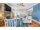 Living room with hardwood floors, stone fireplace, and view of kitchen at 2408 Rozzelles Ferry Rd, Charlotte, NC 28208