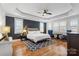 Main bedroom with dark walls, hardwood floors, and sitting area at 2408 Rozzelles Ferry Rd, Charlotte, NC 28208