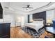 Main bedroom with hardwood floors, and a sitting area at 2408 Rozzelles Ferry Rd, Charlotte, NC 28208