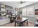 Home office featuring built-in desk and wall of framed art at 2408 Rozzelles Ferry Rd, Charlotte, NC 28208