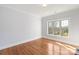 Cozy bedroom with hardwood floors, base molding and plenty of natural light at 2907 Cutter Ct, Waxhaw, NC 28173