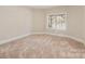 Bedroom with neutral carpet, a double hung window, and ample natural light at 2907 Cutter Ct, Waxhaw, NC 28173