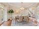 Elegant dining room featuring a chandelier, hardwood floors, and natural light at 2907 Cutter Ct, Waxhaw, NC 28173