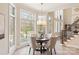 Bright dining room with large windows and elegant chandelier at 2907 Cutter Ct, Waxhaw, NC 28173