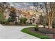 Charming two-story brick home with lush landscaping, a circular driveway, and a grand entrance at 2907 Cutter Ct, Waxhaw, NC 28173