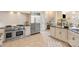 Bright kitchen featuring stainless steel appliances, granite countertops, and white cabinetry at 2907 Cutter Ct, Waxhaw, NC 28173