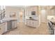 Bright kitchen with stainless steel appliances, built in microwave, white subway tile backsplash, and granite countertops at 2907 Cutter Ct, Waxhaw, NC 28173