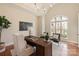 Bright home office with a vaulted ceiling, large window, and wooden desk at 2907 Cutter Ct, Waxhaw, NC 28173