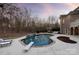 Stunning backyard pool with diving board, stone accents, and lounge chairs for relaxing at 2907 Cutter Ct, Waxhaw, NC 28173