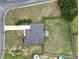 Aerial view of the home, backyard, deck, and landscaping at 2935 Dairy Farm Dr, Monroe, NC 28110