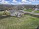 Aerial view of the home, backyard, wooden fence, and deck at 2935 Dairy Farm Dr, Monroe, NC 28110