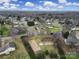 Aerial view showcasing the neighborhood, home, and surrounding landscape at 2935 Dairy Farm Dr, Monroe, NC 28110