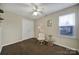 Cozy bedroom with a ceiling fan, carpet flooring and natural light at 2935 Dairy Farm Dr, Monroe, NC 28110