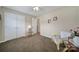 Neutral bedroom featuring carpet, a ceiling fan, and a view into the hallway at 2935 Dairy Farm Dr, Monroe, NC 28110